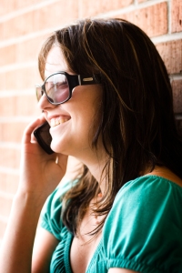 Girl talking on a cell phone, smiling